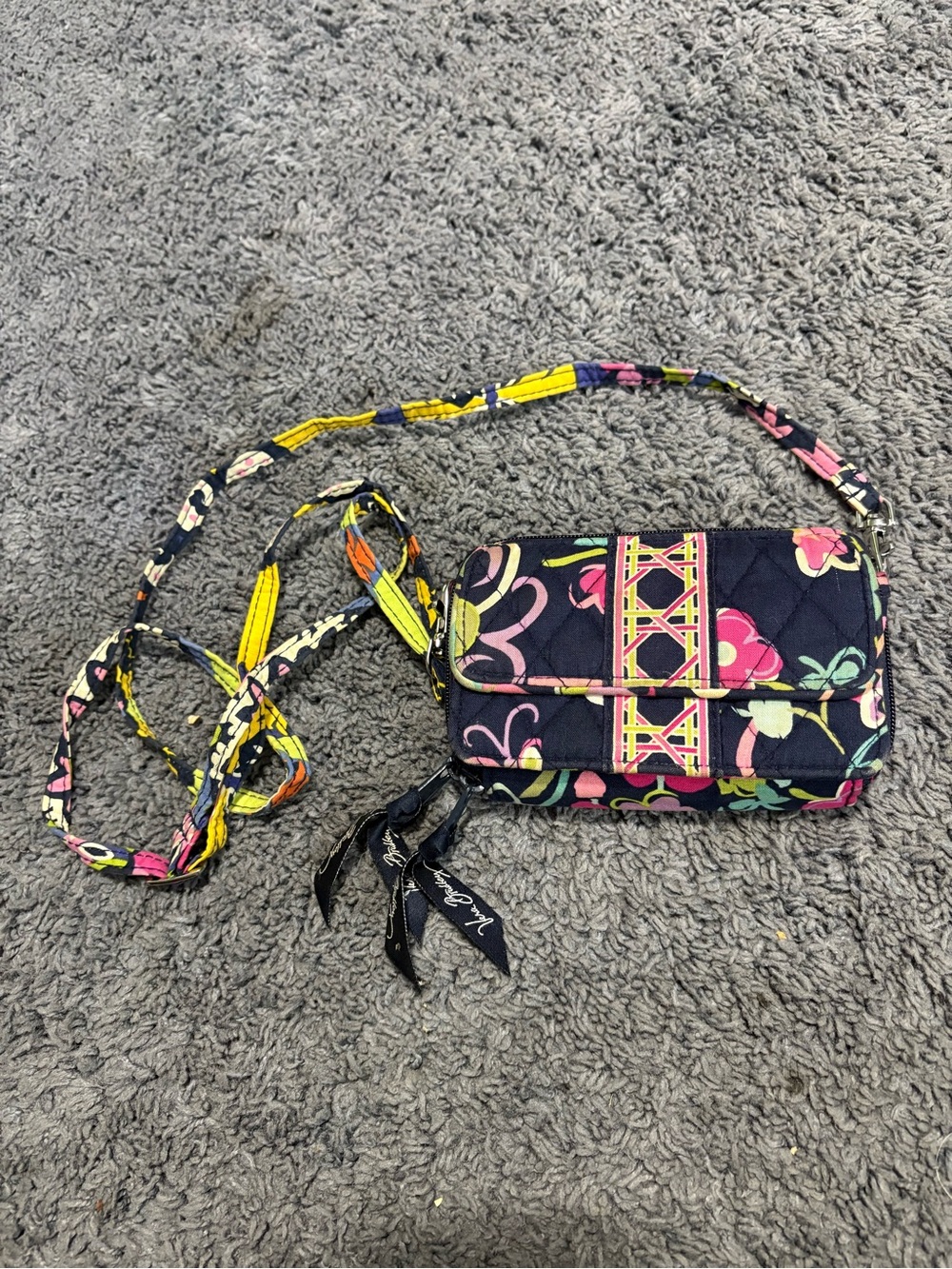 Lightly used Vera Bradley floral wallet with a strap to wear over the shoulder